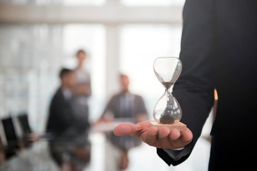 businessman holding hour glass signifies importance being time 53876 13940 1