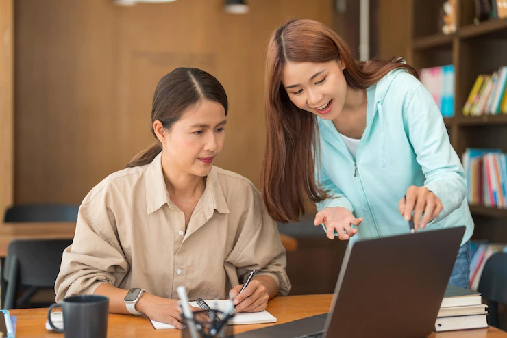 education concept teenage girl pointing laptop asking question tutor while study tutorial 1423 5836