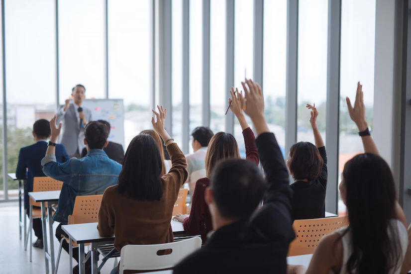 raised up hands arms large group seminar class room agree with speaker conference seminar meeting room 29360 140