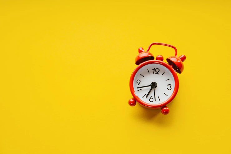 red alarm clock yellow paper background minimalistic image 400481 559