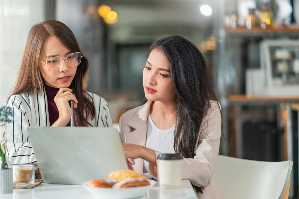 asian female creative agency casual meeting discussion working with laptop coffee work from home with client co workerasian young woman with window water rain drop raining background