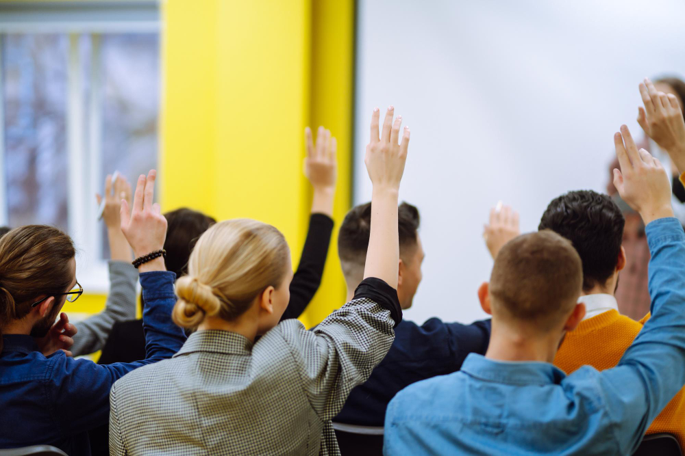 business people raising hand up ask question with speaker 1