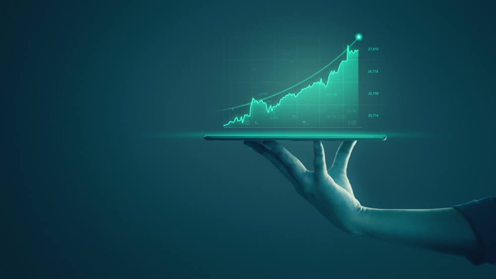 businessman holding tablet showing holographic graphs stock market statistics gain profits