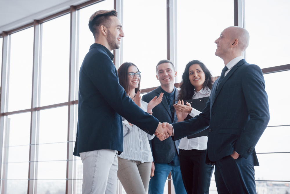 two confident business man shaking hands during meeting office success dealing greeting partner