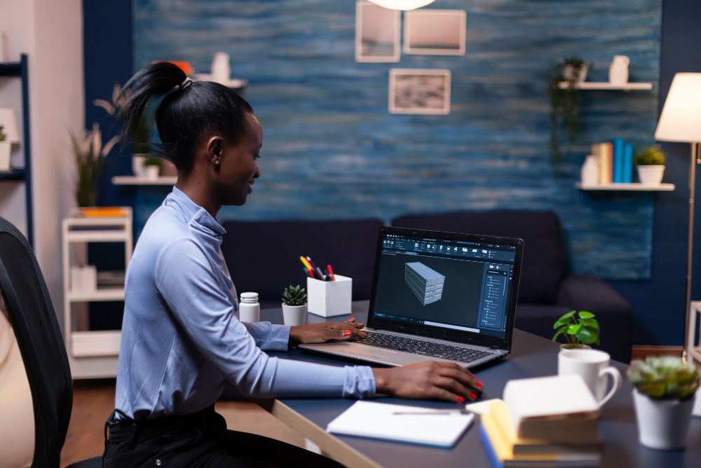 focused dark skinned woman working project deadline industrial black female engineer studying prototype idea personal computer showing software device display