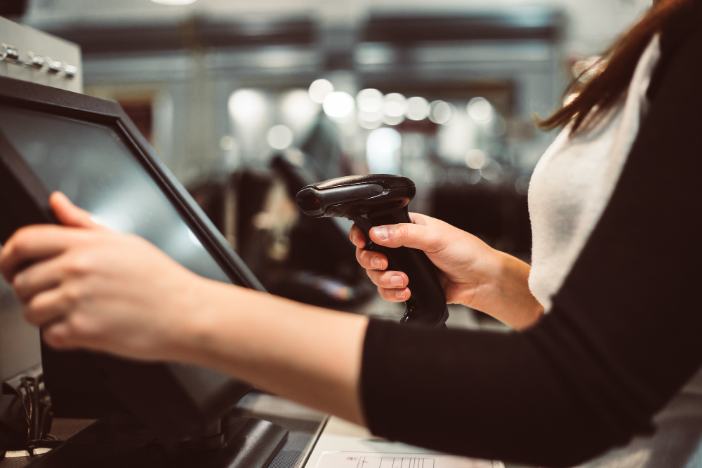 young woman hand doing process payment touchscreen cash register finance concept